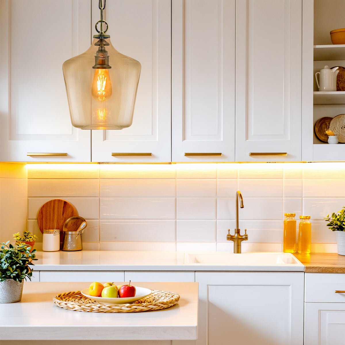 Single clear glass pendant light with bell-shaped shade and antique brass-effect ceiling fitting